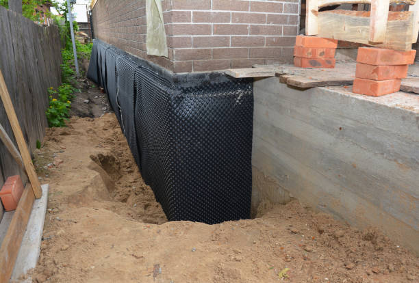 Happy homeowners after waterproofing job in Burnettsville